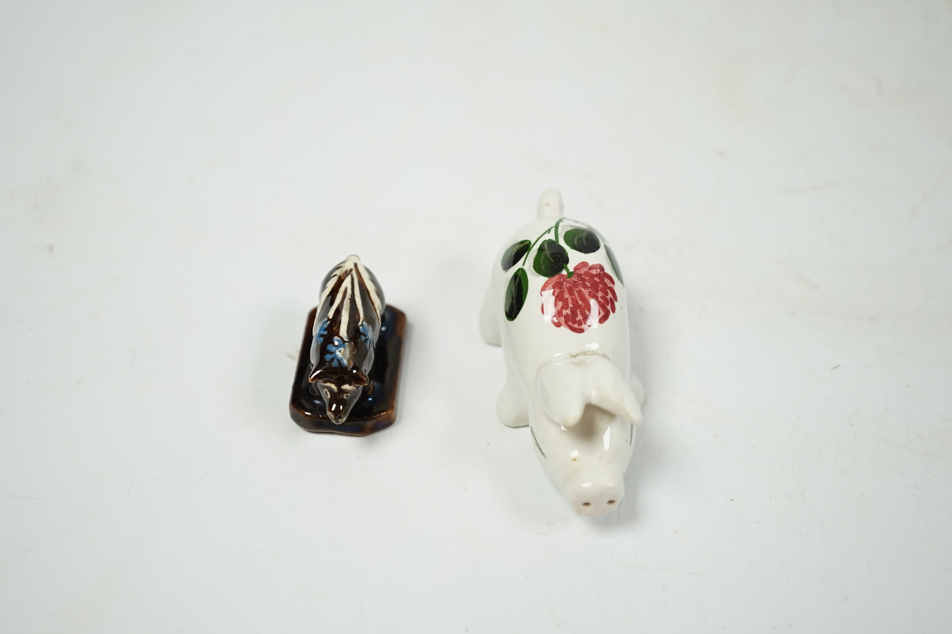 A miniature Plichta pig and a very miniature Slipware pig, Plichta pig 8cm long. Condition - fair to good